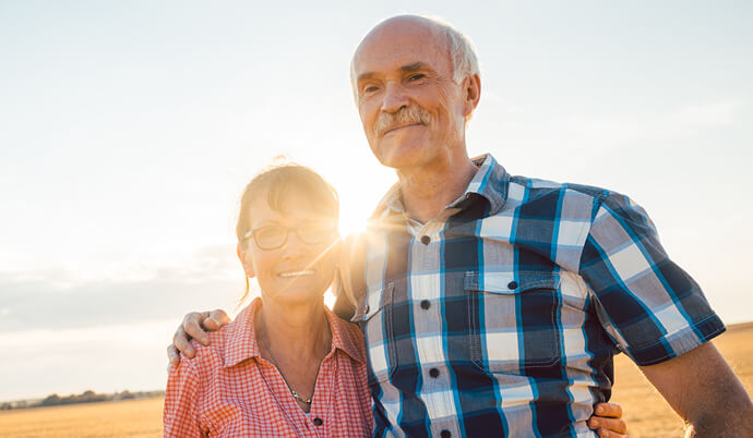 Man and woman, a senior couple, embracing each other still being in love