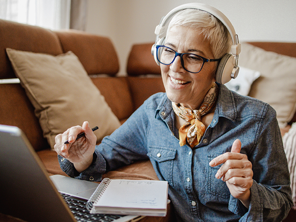 smiling woman with headphones on