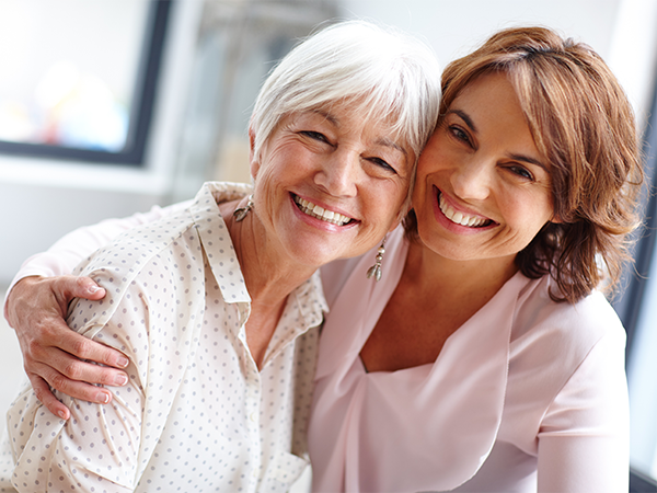 Two women smiling