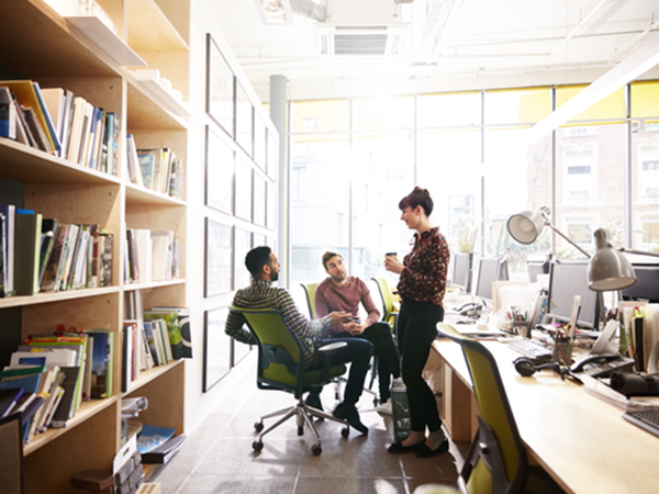 People in an office talking