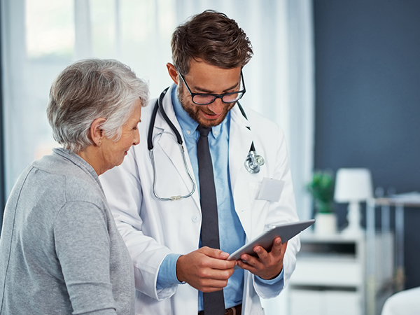doctor with elderly woman