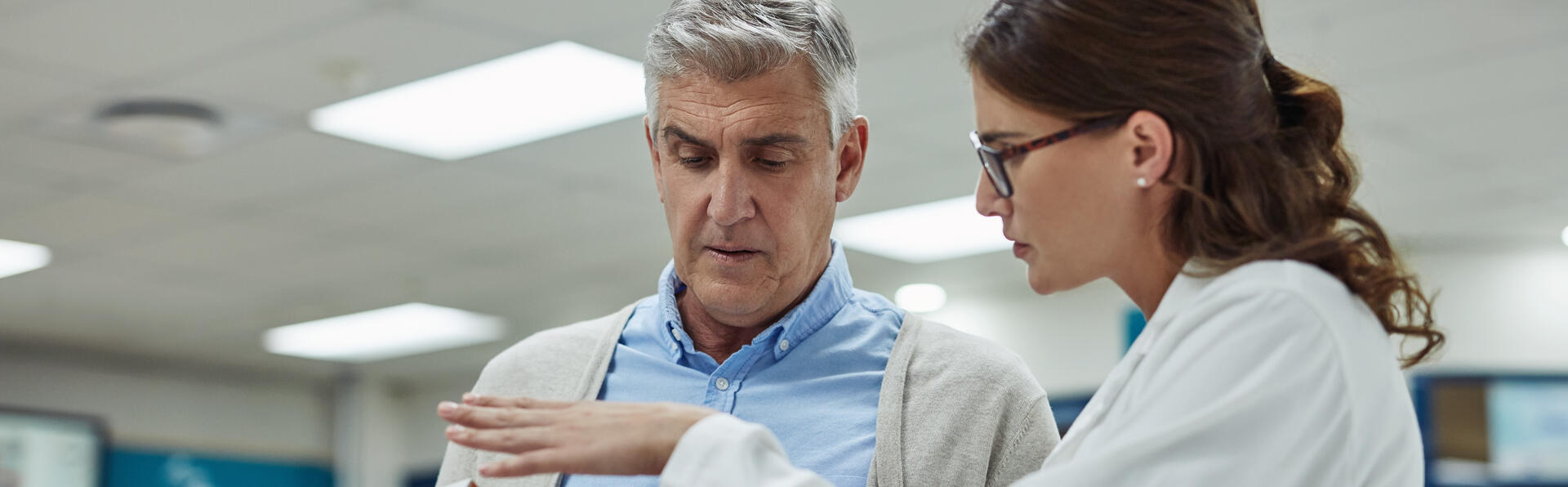 Pharmacist discussing medication with a patient