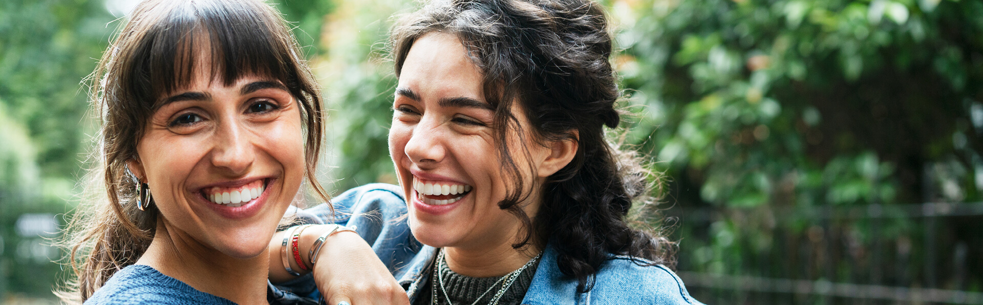 Two women smiling outside