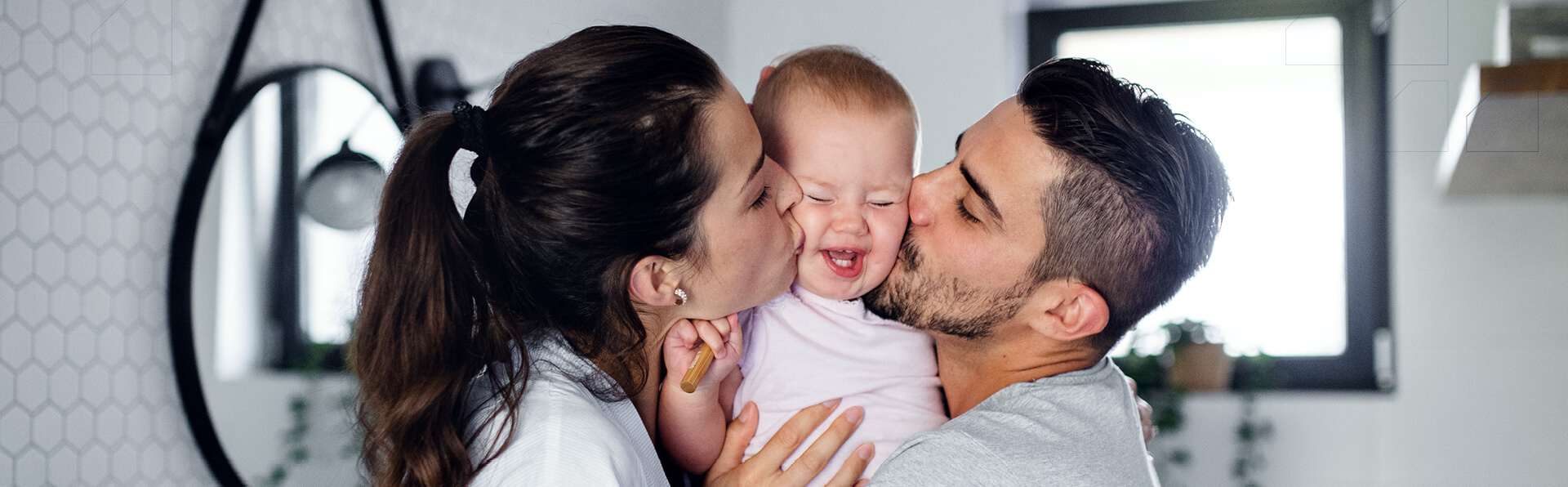 Man, woman with lilttle daughter holding wooden toothbrush.